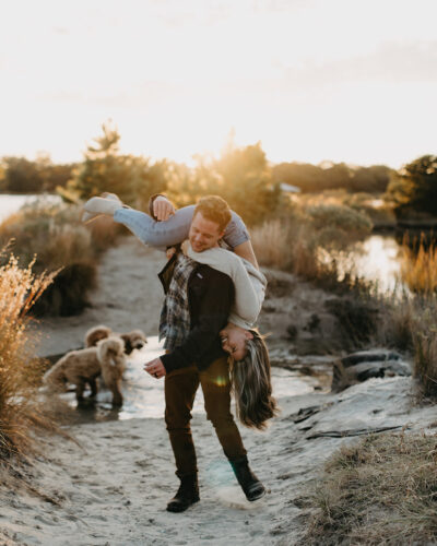 Engagement photos at pleasure house point in Virginia Beach. Couples golden hour photos at the beach. Virginia Beach Wedding photographer.
